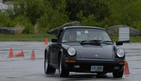 Bill  Kallgren
Billâ€™s ubiquitous black 911, code name â€œ8-Ballâ€, working out in the rain.
