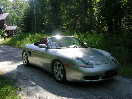 Ed Boadhead
Ed and Nancy Broadhead's 2000 Boxster S. Silver w/"red" leather interior. (More like clay  flowerpot than red, I'd say. -Nancy) Usual accessories: radio w/CD,  floormats, traction control. Lowered, sport springs, factory sport  exhaust. Black top, Armor-Fend front protection.
