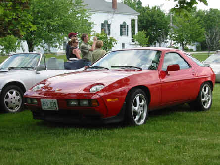 Erik & Leah Esslinger
Erik & Leah Esslinger's 928
1986.5 model. 29,000 original miles. Guards Red / Black int. Automatic. Rear Ac option. 928 Specialists Rear Muffler Bypass installed. 17" Turbo Twist wheels with Khumo Ecsta Supra ZR tires. Other than that, it is very original, and mint.
