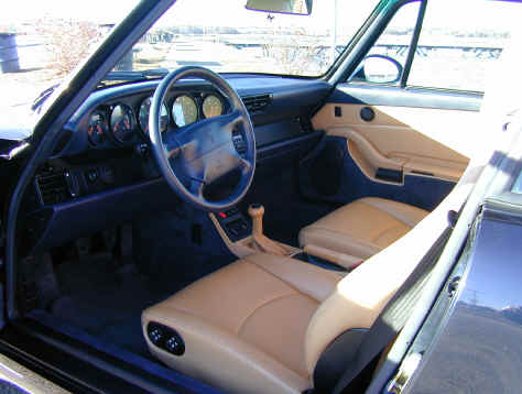 John Geisel & Betsy McNamara
John Geisel and Betsy McNamara's 1995 993 coupe
"We are the second owners, car was born in Germany, and raised in or around Tampa, Fla.
We bought the car in late July 2001, with 23,000 actual miles. The car is a Carrera 2, six speed, 3.6 liter engine, six CD stereo music system. We love the car - it turns a few heads." - John


