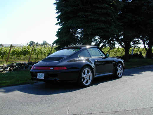 Paul Tallo
Paul's 1998 (993) Carrera 4S. 
"When it was time to buy my Porsche this year my selection process narrowed in very quickly - my favorite has always been a "widebody" and it HAD to be black....... Previous owner only put 1000 miles on it last season (good for me, but what a shame not to enjoy driving it more), I've put 3000 miles on it in the first few months I've had it ! "BIG-BRO" plate is for my involvement in the Big Brothers program. My "little brother" will be getting a plate something like "LTL-BRO" once he gets his license later this year.." - Paul
